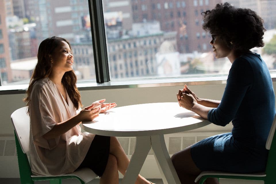 Two colleagues in conversation